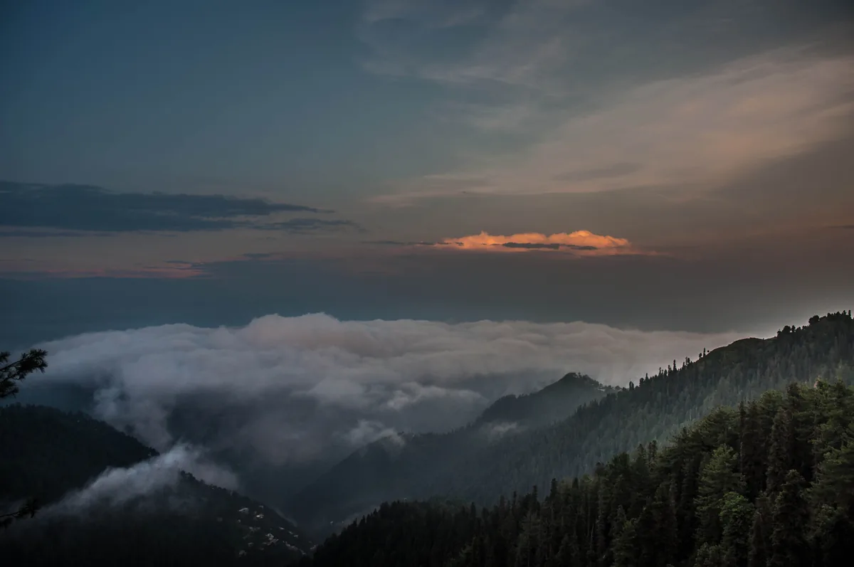Monsoon clouds below the pine-forested ridges of the Galyat in the Lesser Himalaya near Murree, Pakistan