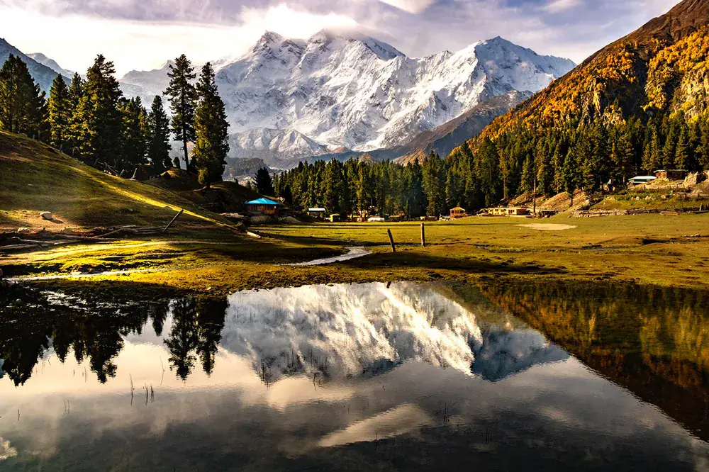 Nanga Parbat reflected in an alpine pool at Fairy Meadows, northern Pakistan, at golden hour