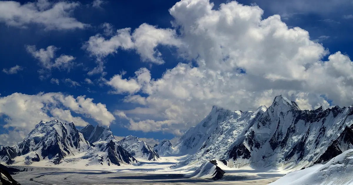 Snow Lake (Lukpe Lawo), the vast glacier basin of the central Karakoram, with jagged white peaks under towering summer clouds