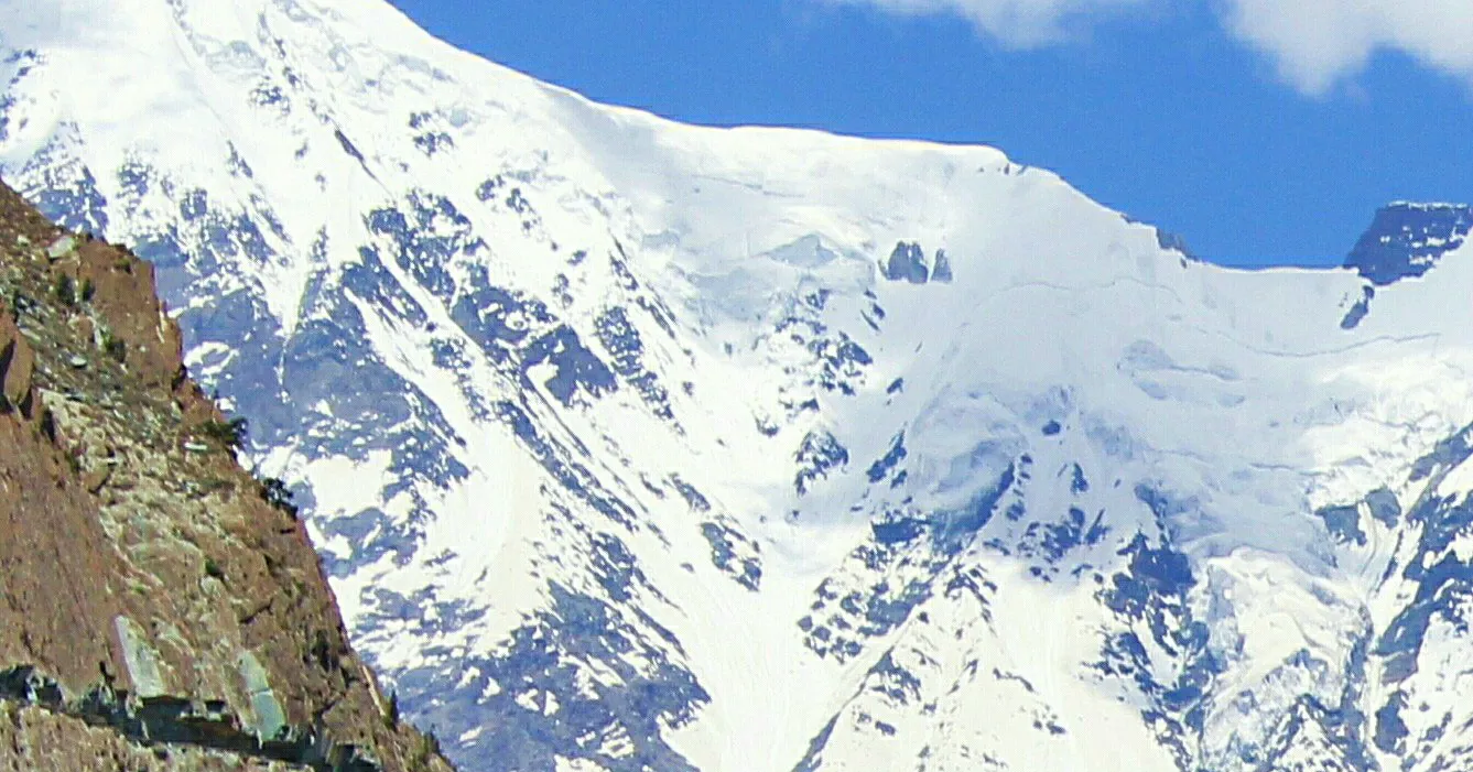 A trekker looking up Bagrote Valley towards the Rakaposhi massif near Gilgit, Gilgit-Baltistan
