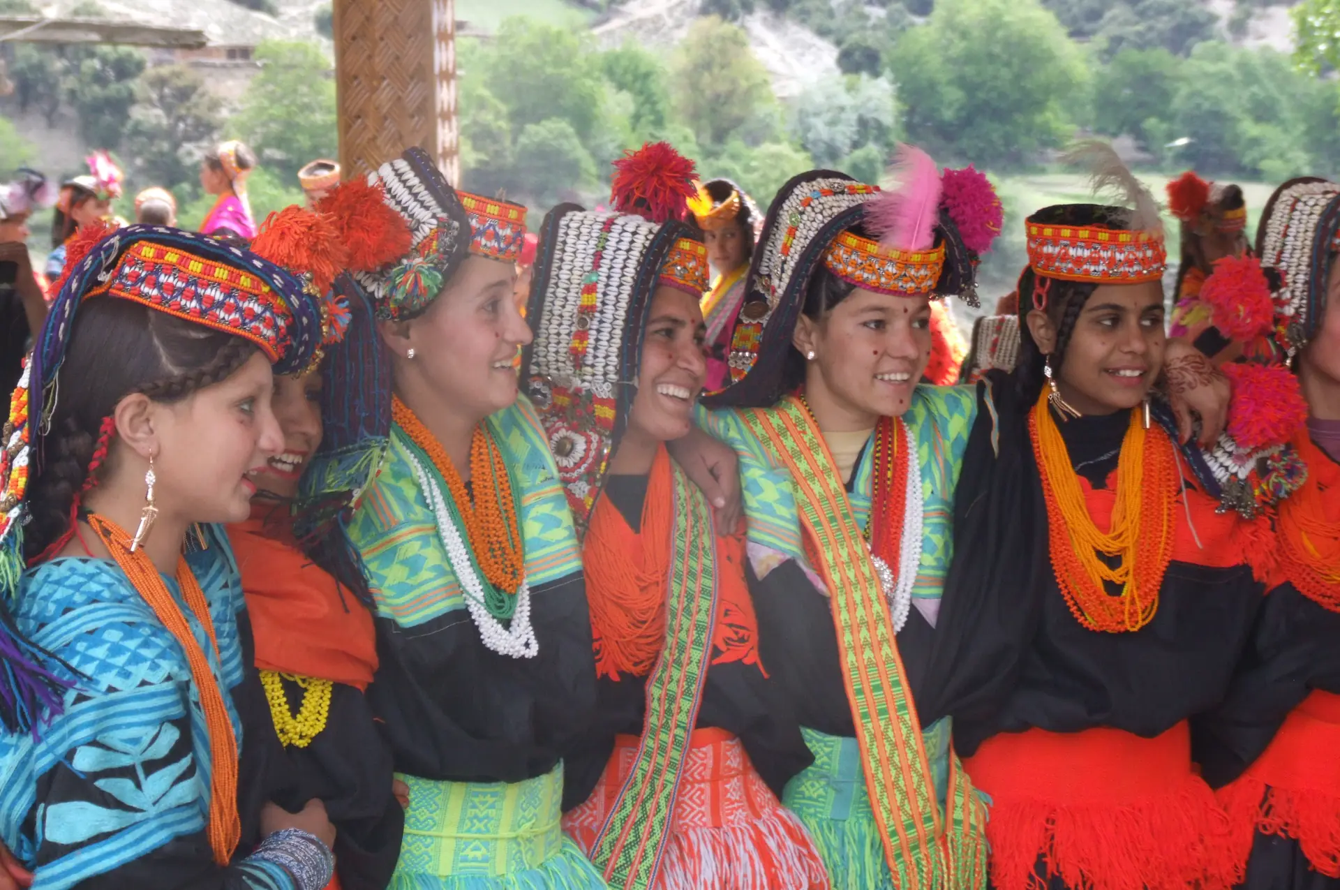 Young Kalash women in traditional dress at the Chilam Joshi festival in Bumburet valley
