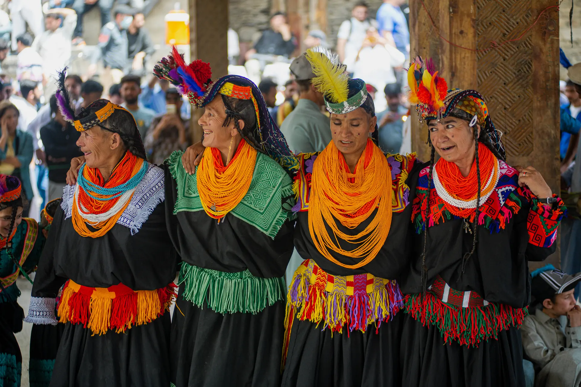 Kalash women performing the linked-arm circle dance at Chilam Joshi