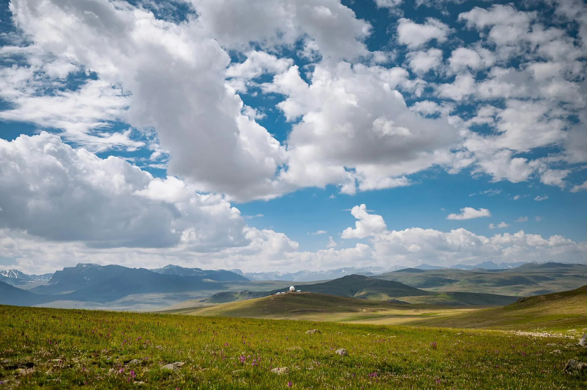 Brown mountains surrounding a high-altitude lake