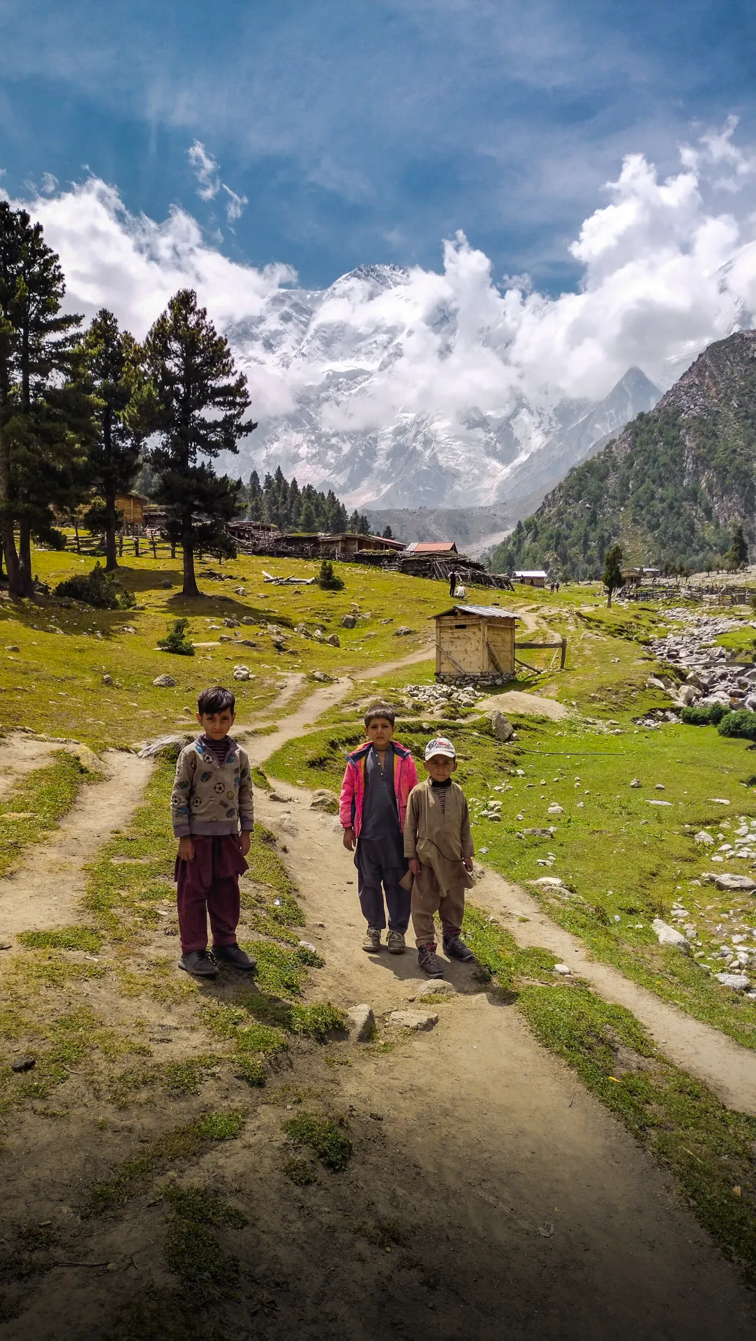 Local children on the trail at Fairy Meadows with Nanga Parbat rising behind