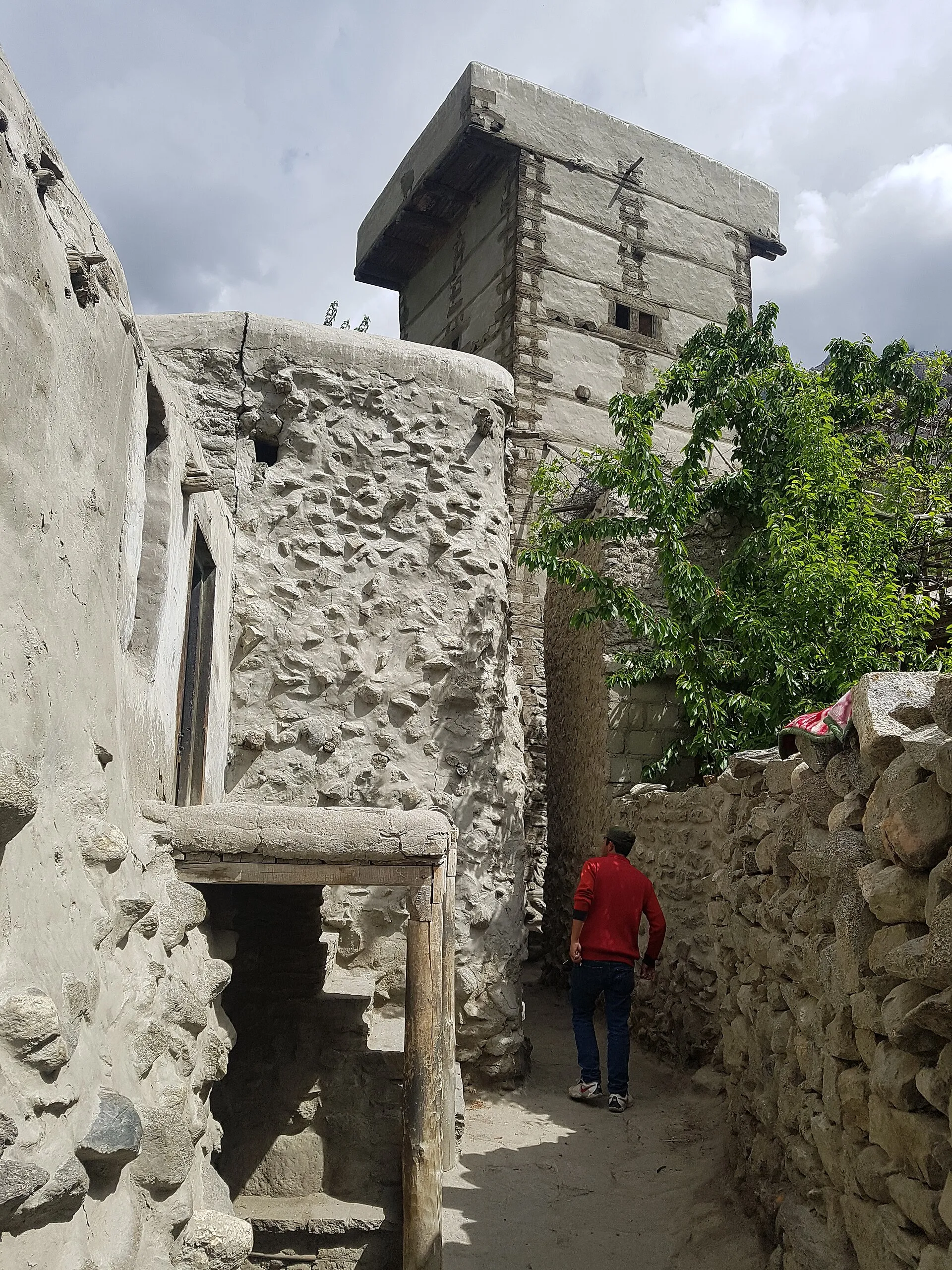 A narrow stone lane through an old village in the Hunza Valley