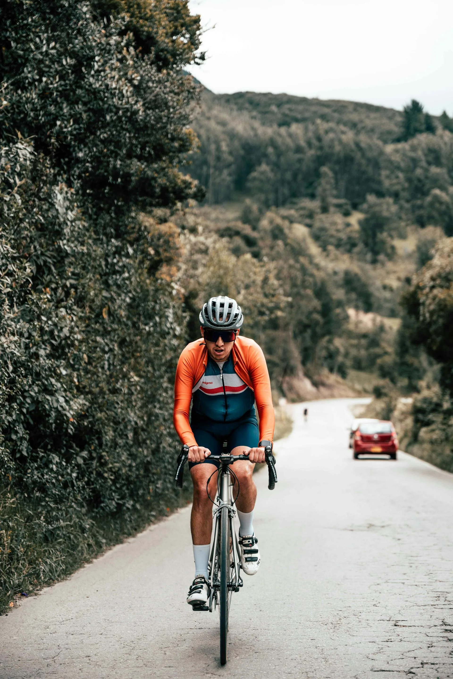 Cyclist climbing hill