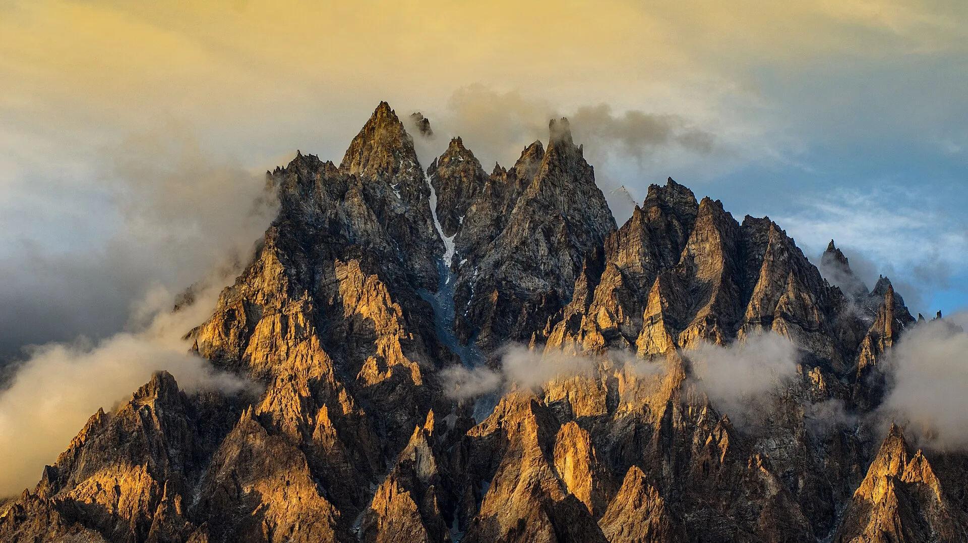 The jagged Passu Cones catching golden light above upper Hunza
