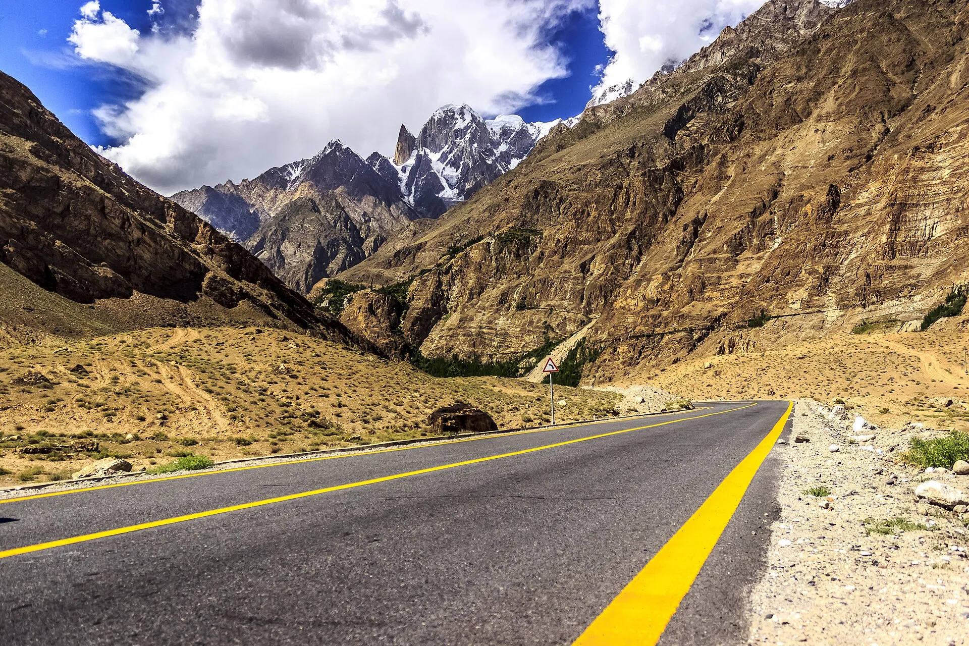 The Karakoram Highway centre line toward the peaks