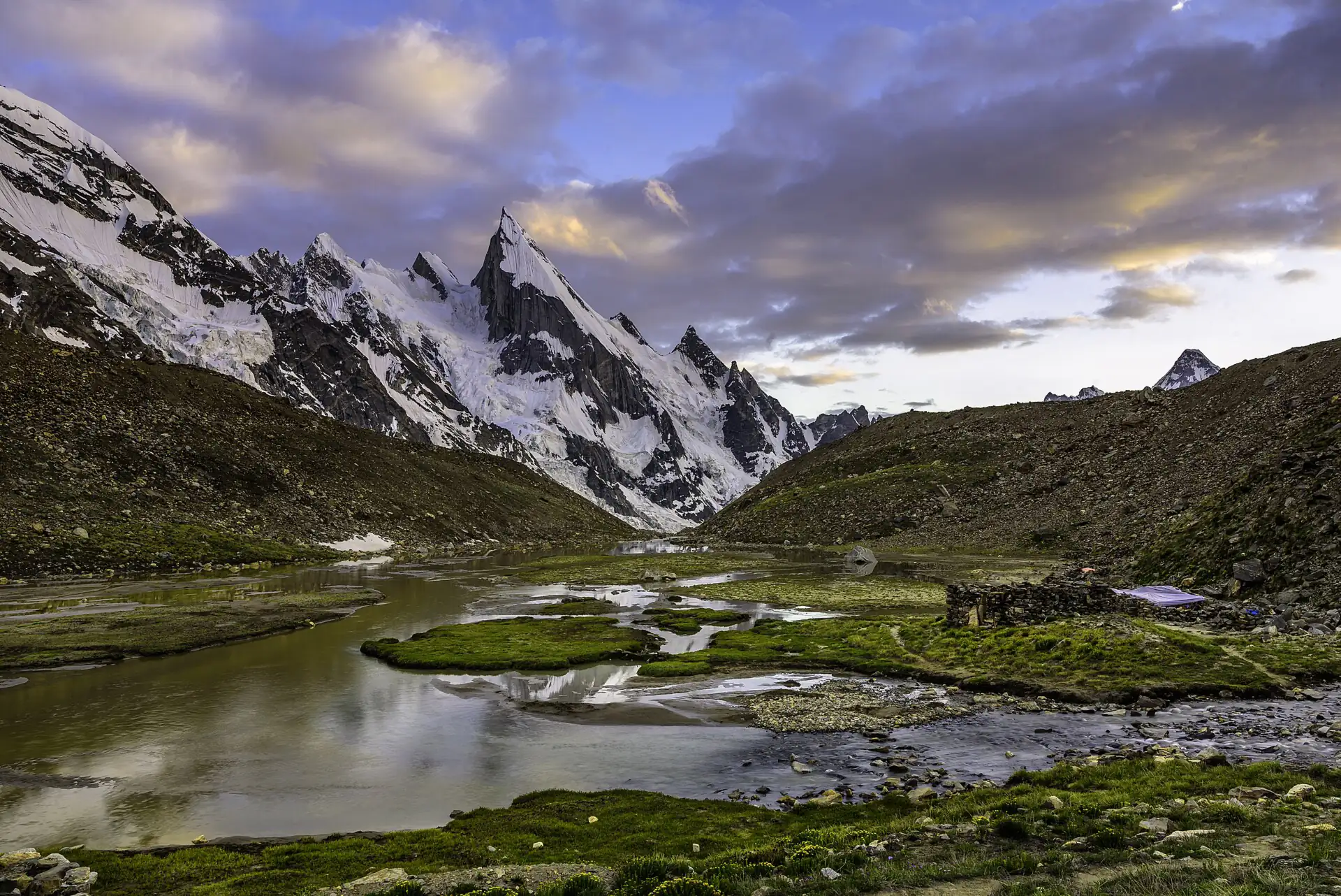 Laila Peak's spire above a meltwater meadow by the Gondogoro glacier in the Hushe valley, Karakoram