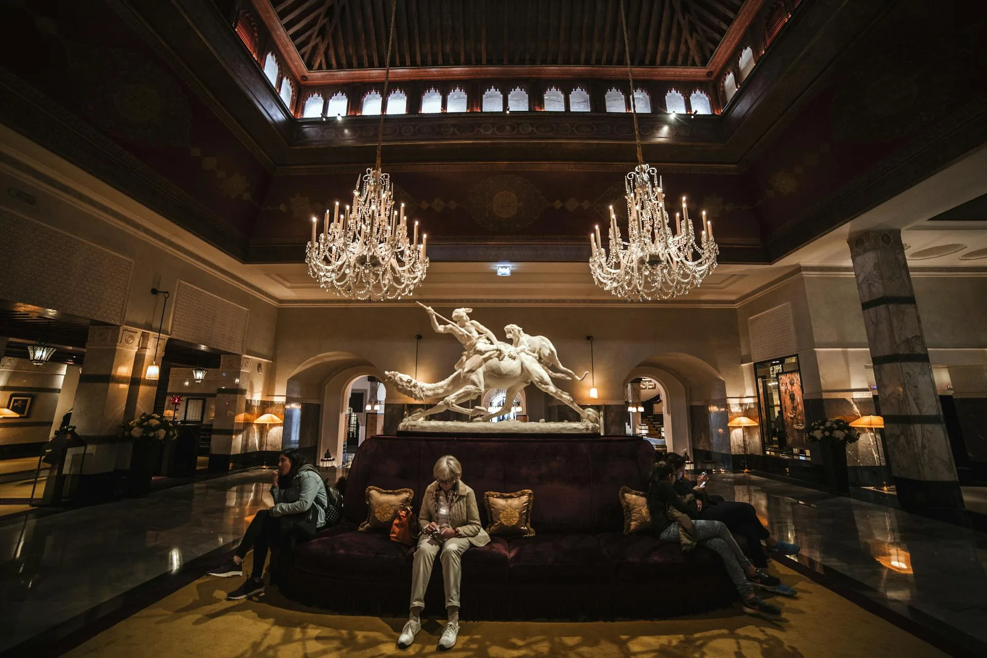 Spacious luxury hotel lobby with chandeliers