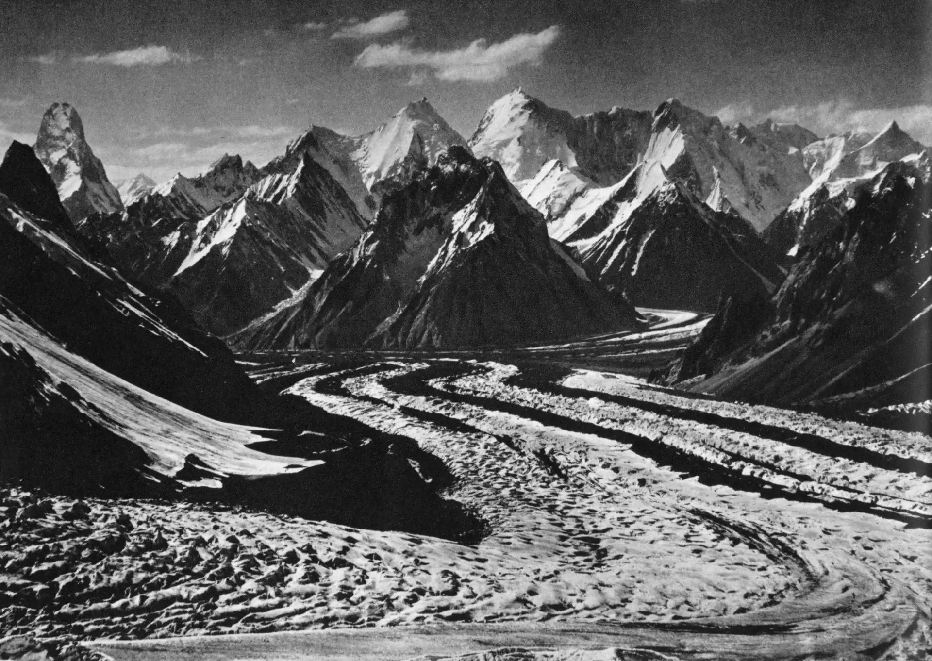 Muztagh Tower's tooth-shaped summit above the upper Baltoro glacier, photographed by Vittorio Sella in 1909