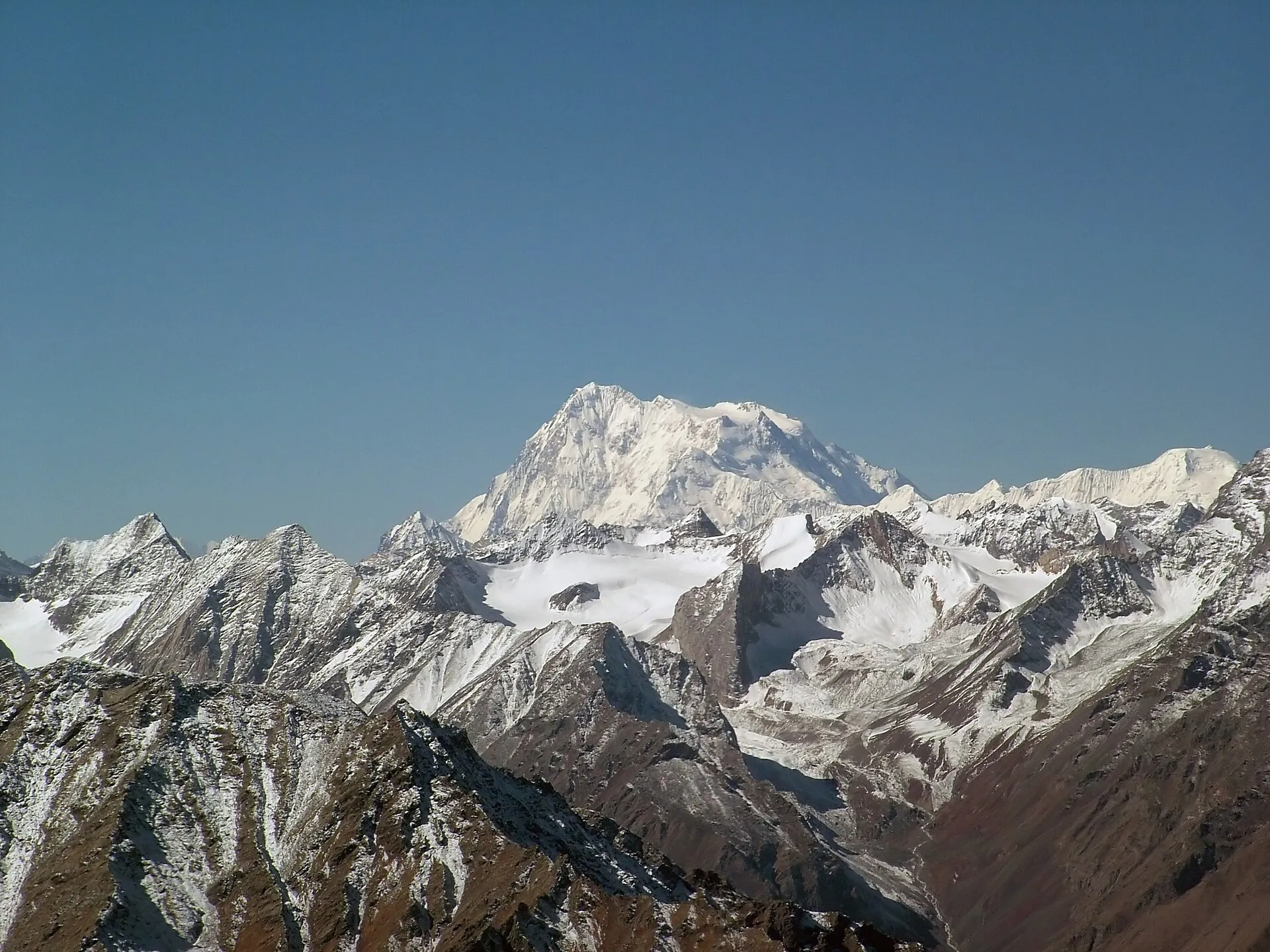 The Nanga Parbat massif rising above a rocky ridge in Gilgit-Baltistan