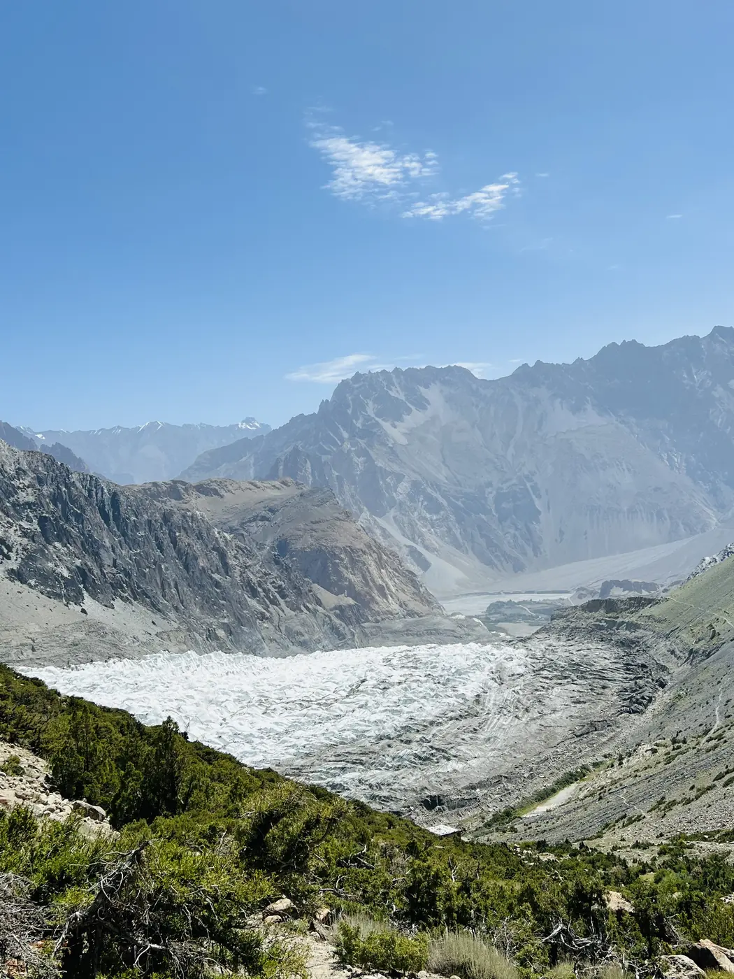 The Passu Glacier seen from the juniper slopes on the trail to Patundas Meadows, Gojal