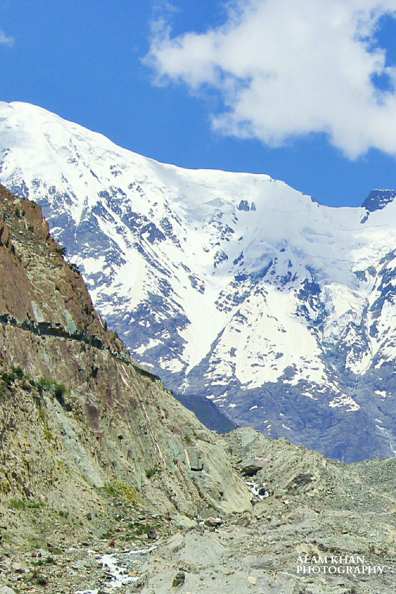 A snow-capped peak of the Rakaposhi-Haramosh massif above Rush Lake
