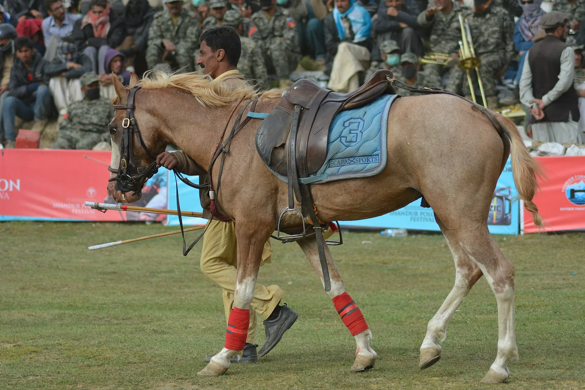 A mounted polo player at the Shandur Polo Festival