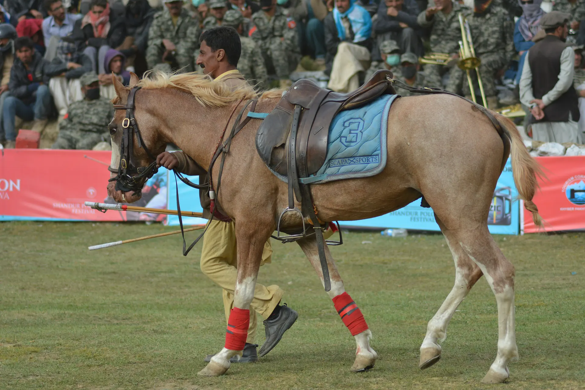 Mounted rider in festival dress at Shandur