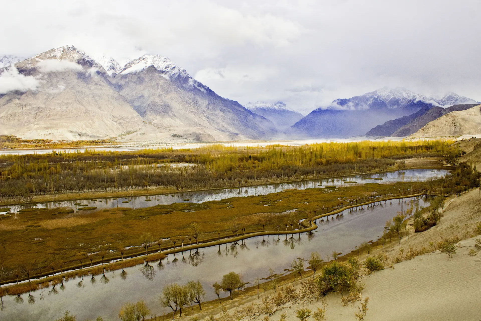 A stream winding through the green Skardu valley