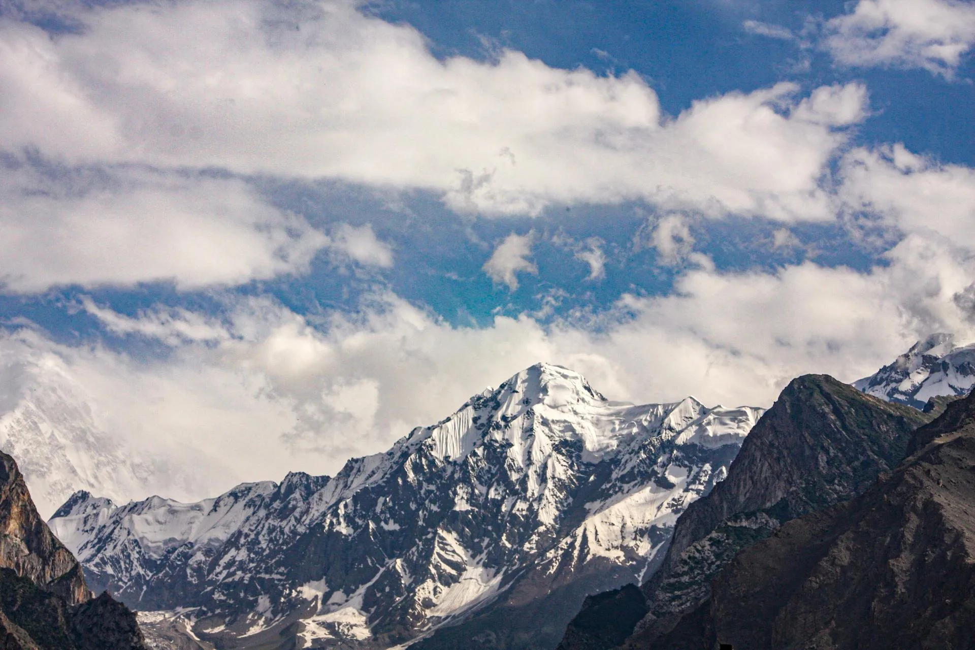A towering snow-capped mountain peak on the trek route