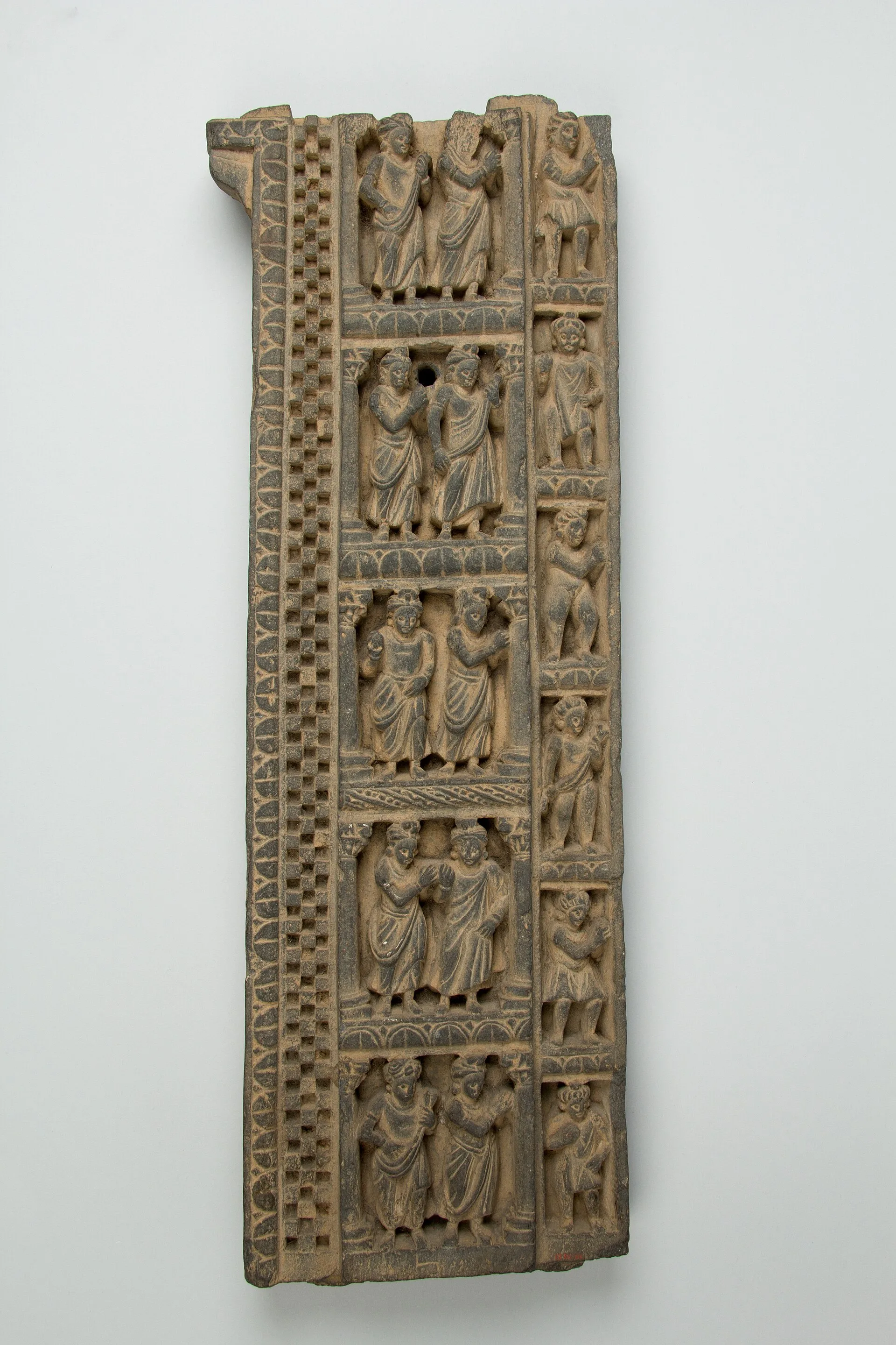 A carved Gandhara stone relief from Taxila