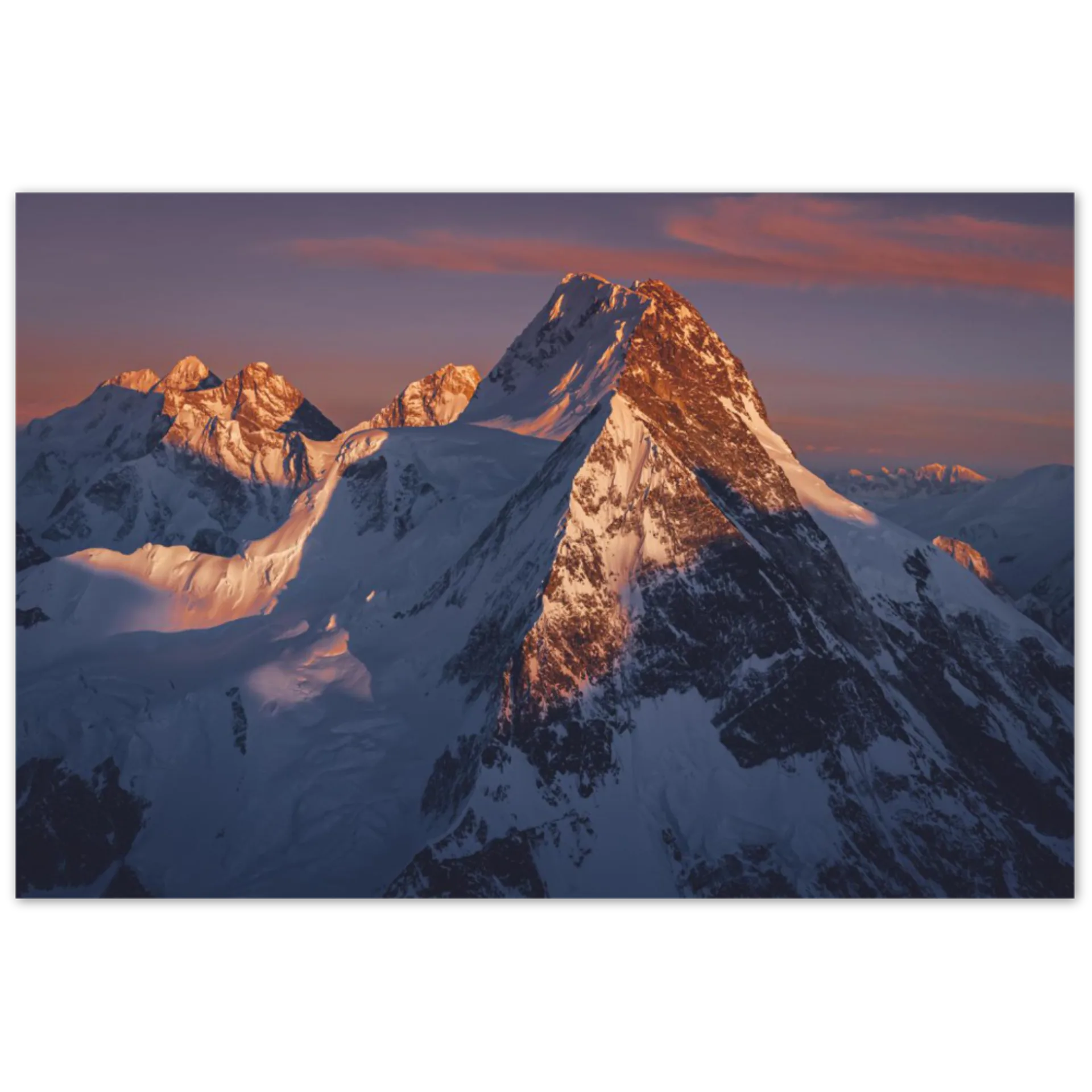 Broad Peak aerial view at golden hour sunset with snow-covered ridges Karakoram Pakistan