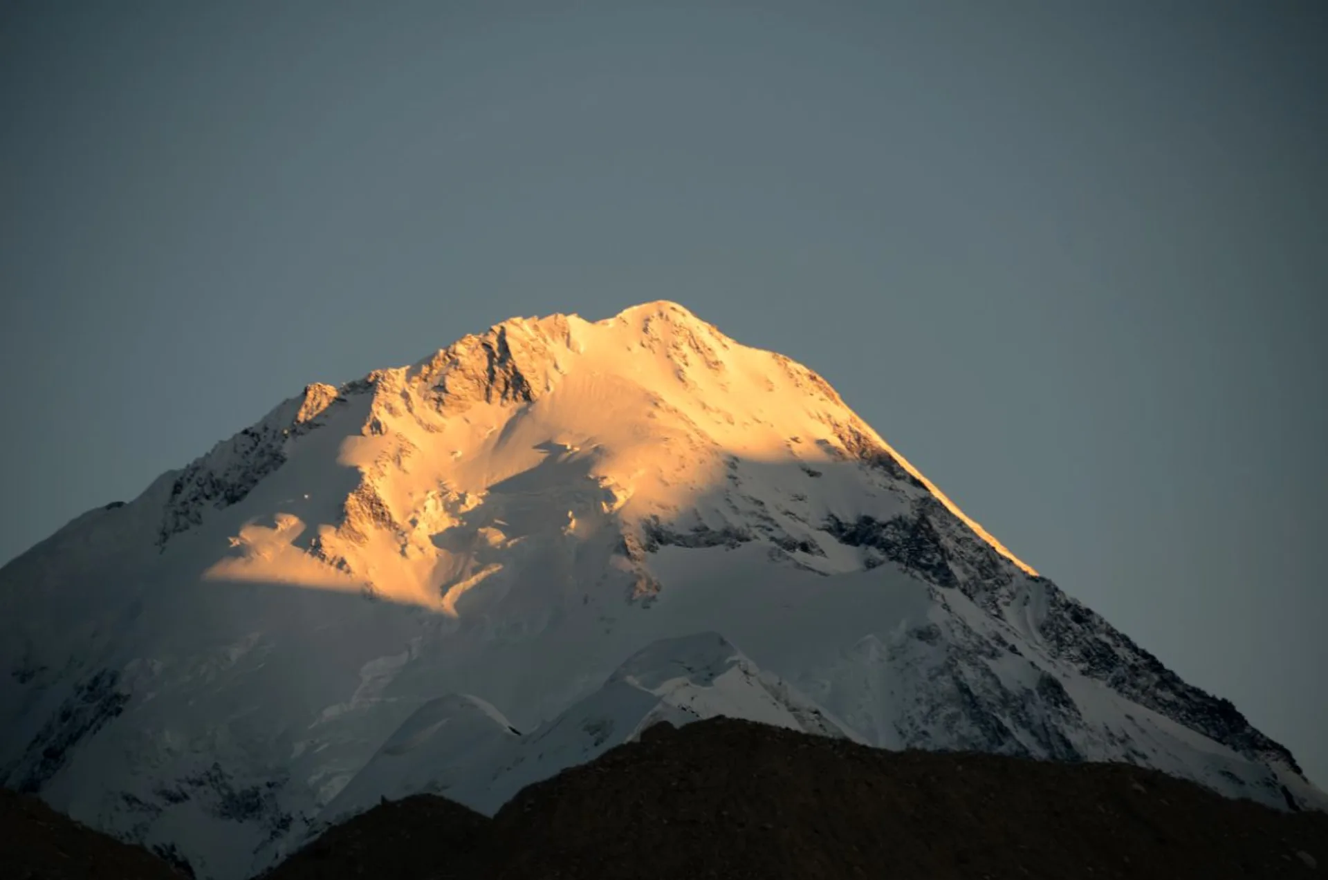 Gasherbrum I north face glowing golden at sunset, Hidden Peak 8080m Karakoram Pakistan