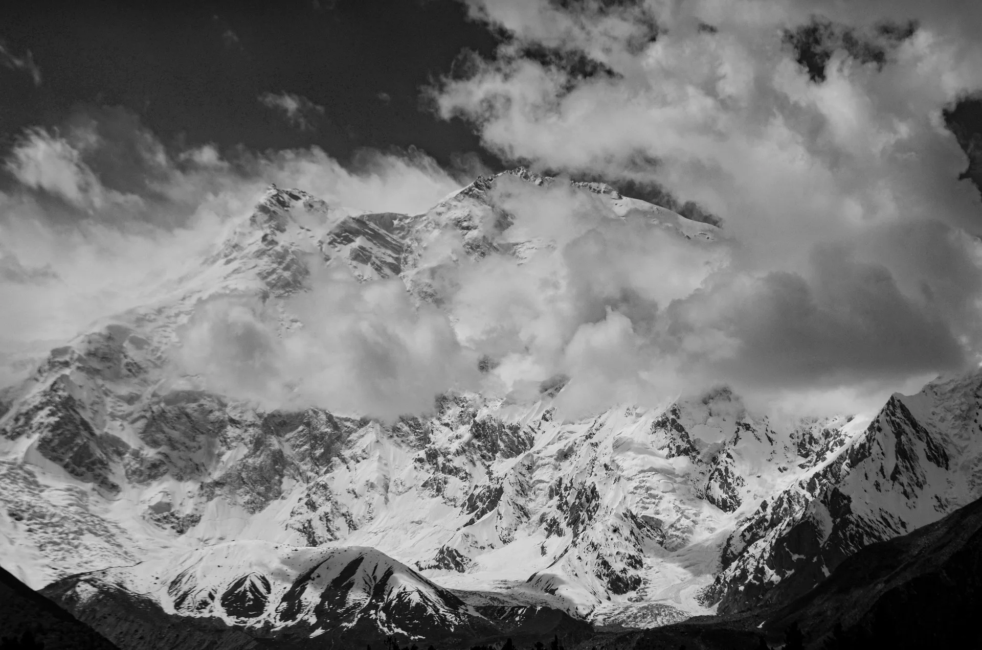 Nanga Parbat close-up of snow-covered summit ridges and glaciers with blue sky