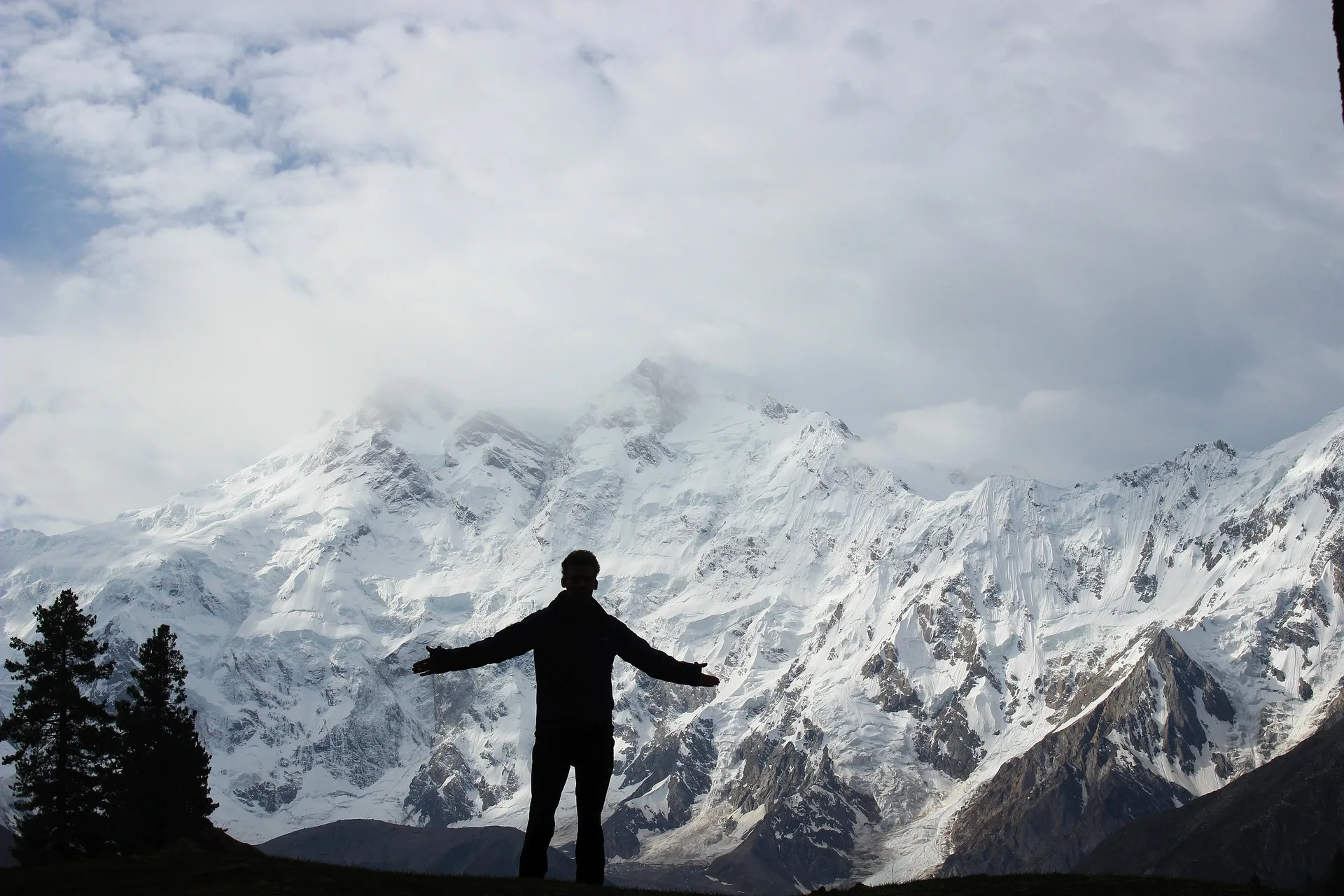 Nanga Parbat dramatic black and white photo with clouds swirling around the Killer Mountain summit